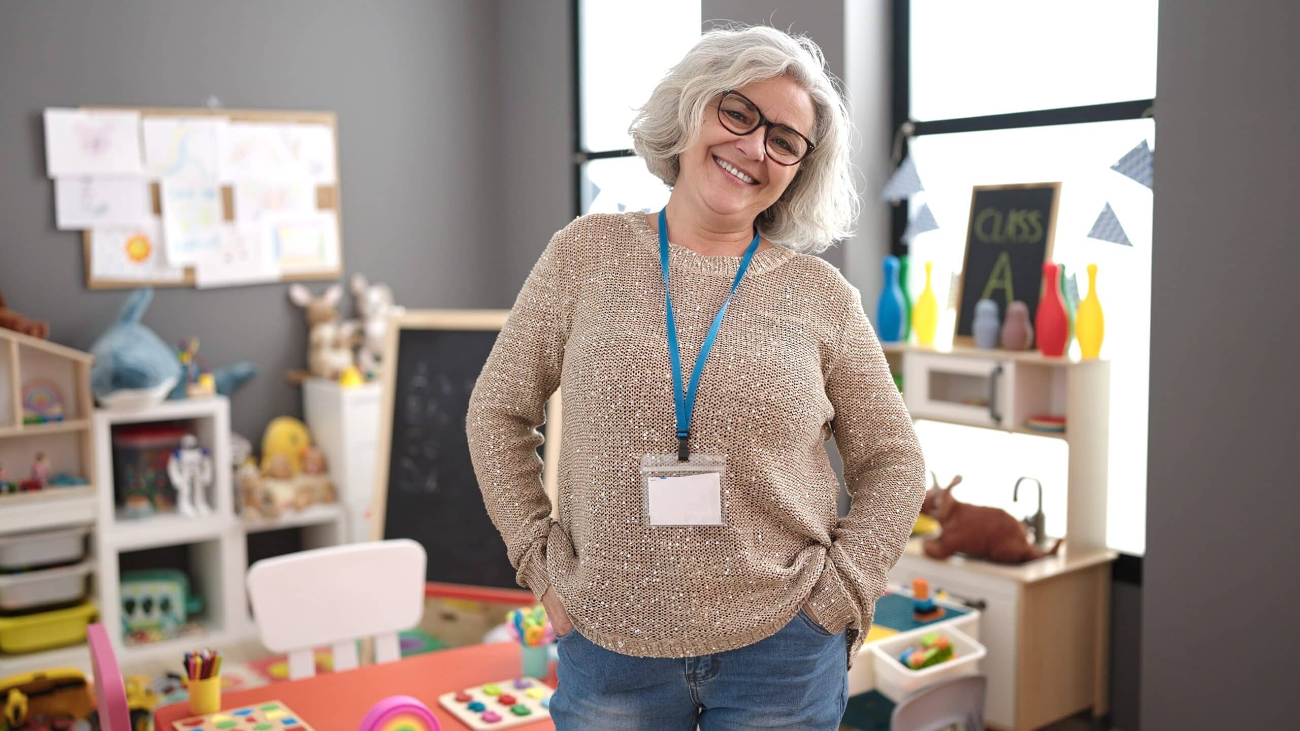 Middle,Age,Woman,With,Grey,Hair,Preschool,Teacher,Smiling,Confident